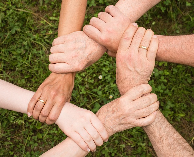 Diverse group of people collaborating happily on a creative project